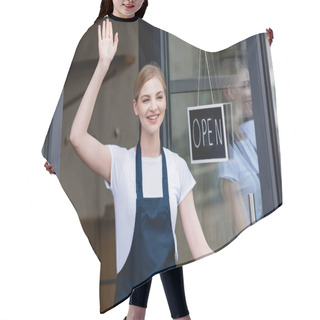 Personality  Positive Waitress Waving Hand Near Signboard With Open Lettering On Door Of Cafe  Hair Cutting Cape