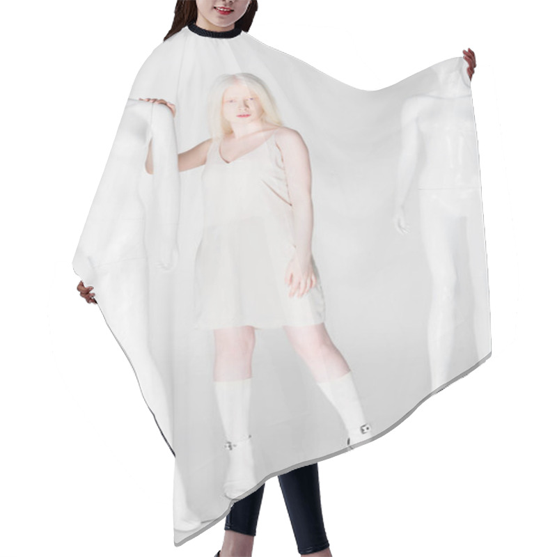 Personality  Full Length Of Albino Model Touching Mannequin On White Background  Hair Cutting Cape