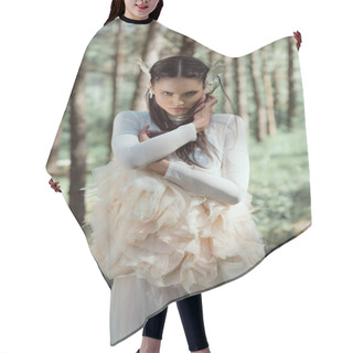 Personality  Adult Woman In White Swan Costume Standing On Forest Background, Holding Hands Near Face Hair Cutting Cape