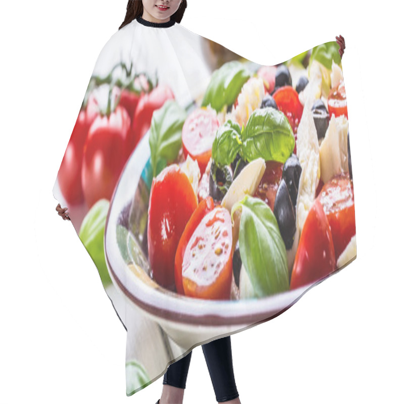 Personality  Caprese. Caprese Salad. Italian Salad. Mediterranean Salad. Italian Cuisine. Mediterranean Cuisine. Tomato Mozzarella Basil Leaves Black Olives And Olive Oil On Wooden Table. Hair Cutting Cape