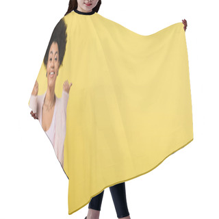 Personality  African American Woman In Cardigan And Top Pointing With Thumbs And Smiling At Camera Isolated On Yellow, Banner Hair Cutting Cape
