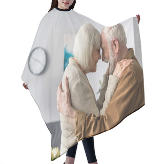Personality  Side View Of Happy Senior Couple Embracing And Laughing While Standing Face To Face Hair Cutting Cape