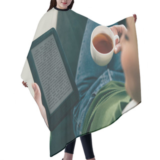 Personality  Selective Focus Of Woman Holding Ebook And Cup With Tea In Hands Hair Cutting Cape