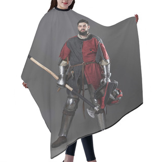 Personality  Medieval Knight On Grey Background. Portrait Of Brutal Dirty Face Warrior With Chain Mail Armour Red And Black Clothes And Battle Axe. Hair Cutting Cape