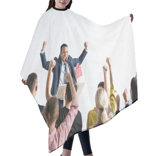 Personality  Excited Indian Speaker Showing Winner Gesture While Standing In Front Of Voters In Conference Hall, Blurred Foreground Hair Cutting Cape