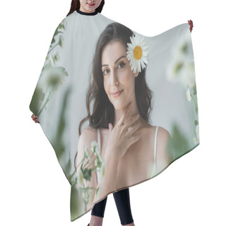 Personality  Portrait Of Smiling Woman With Chamomile In Hair Touching Neck Isolated On Grey  Hair Cutting Cape