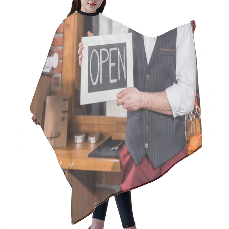 Personality  Cropped Shot Of Barber Holding Open Signboard In Front Of Workplace Hair Cutting Cape