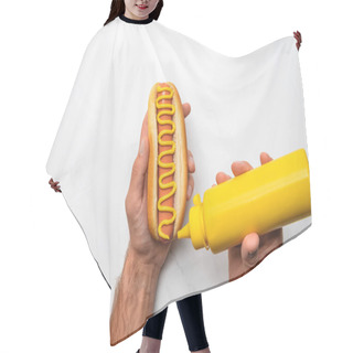 Personality  Cropped Shot Of Man Pouring Mustard Onto Hot Dog On White Marble Surface Hair Cutting Cape