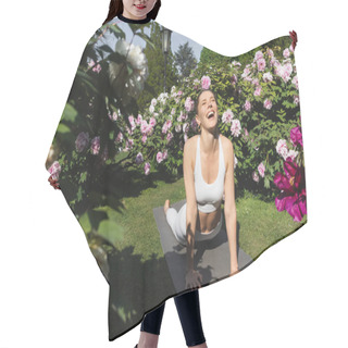 Personality  Laughing Woman With Closed Eyes Practicing Cobra Pose On Yoga Mat Near Blossoming Plants Hair Cutting Cape