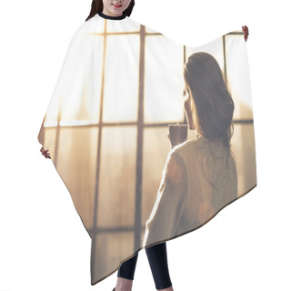 Personality  Young Woman Enjoying Cup Of Coffee In Loft Apartment. Rear View Hair Cutting Cape