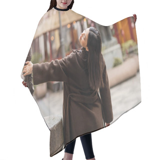 Personality  Back View Of Smiling Brunette Woman Posing Near Lamppost On City Street In Prague Hair Cutting Cape