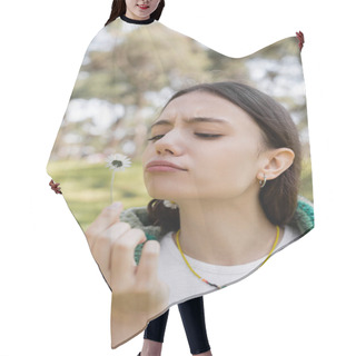 Personality  Focused Young Woman Looking At Daisy Flower In Blurred Summer Park  Hair Cutting Cape