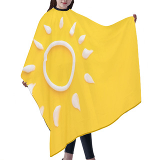 Personality  Top View Of Sun Sign From Sunscreen On Yellow Background  Hair Cutting Cape
