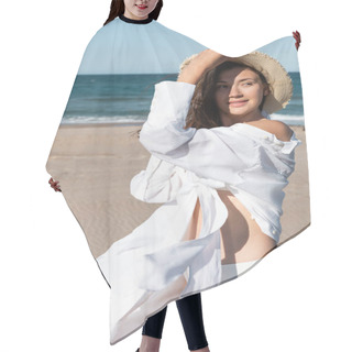 Personality  Cheerful Young Woman In White Shirt Holding Sun Hat Near Sea On Beach  Hair Cutting Cape