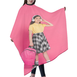 Personality  Excited Schoolgirl In Wireless Headphones Holding Backpack On Pink Background, Brunette Student Hair Cutting Cape