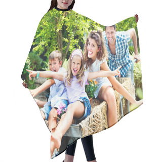 Personality  Family Having Fun With A Barrow In A Greenhouse Hair Cutting Cape