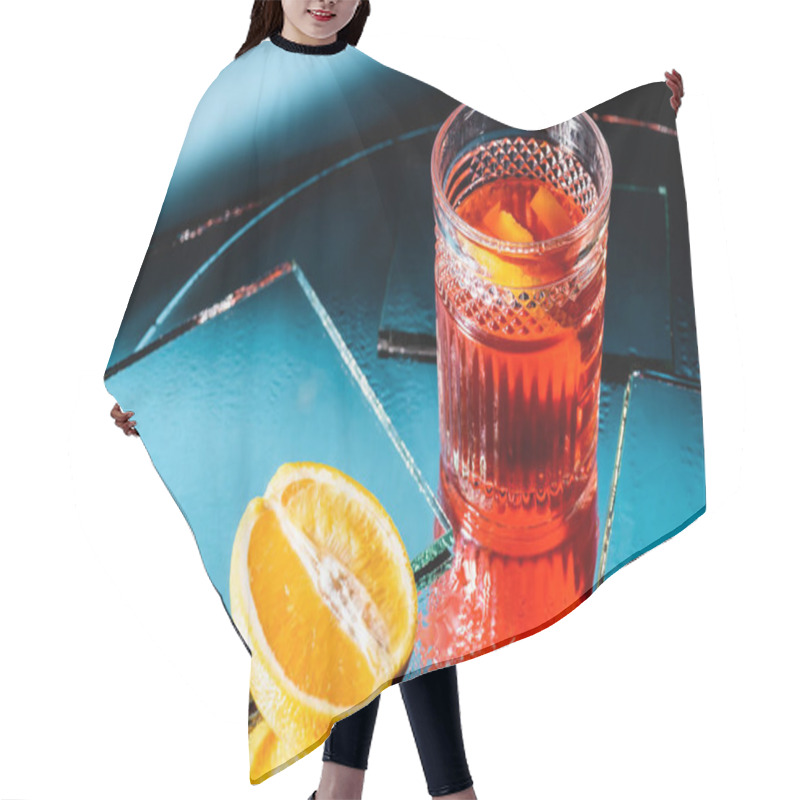 Personality  Mixed Alcohol Cocktail Near Half Of Orange On Blue Hair Cutting Cape