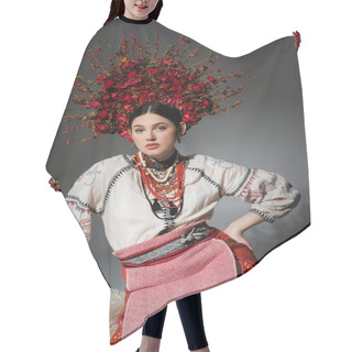 Personality  Pretty Ukrainian Woman In Traditional Clothes And Red Wreath With Flowers Posing With Hand On Hip On Grey Hair Cutting Cape