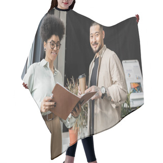 Personality  Asian Businessman With Coffee And African American Businesswoman Looking At Camera In Office Hair Cutting Cape