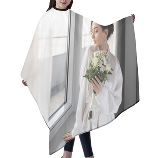 Personality  Young Woman With Engagement Ring On Finger Standing In White Silk Robe And Holding Bridal Bouquet Next To Tulle Curtain And Window In Hotel Suite, Special Occasion, Bride On Wedding Day Hair Cutting Cape