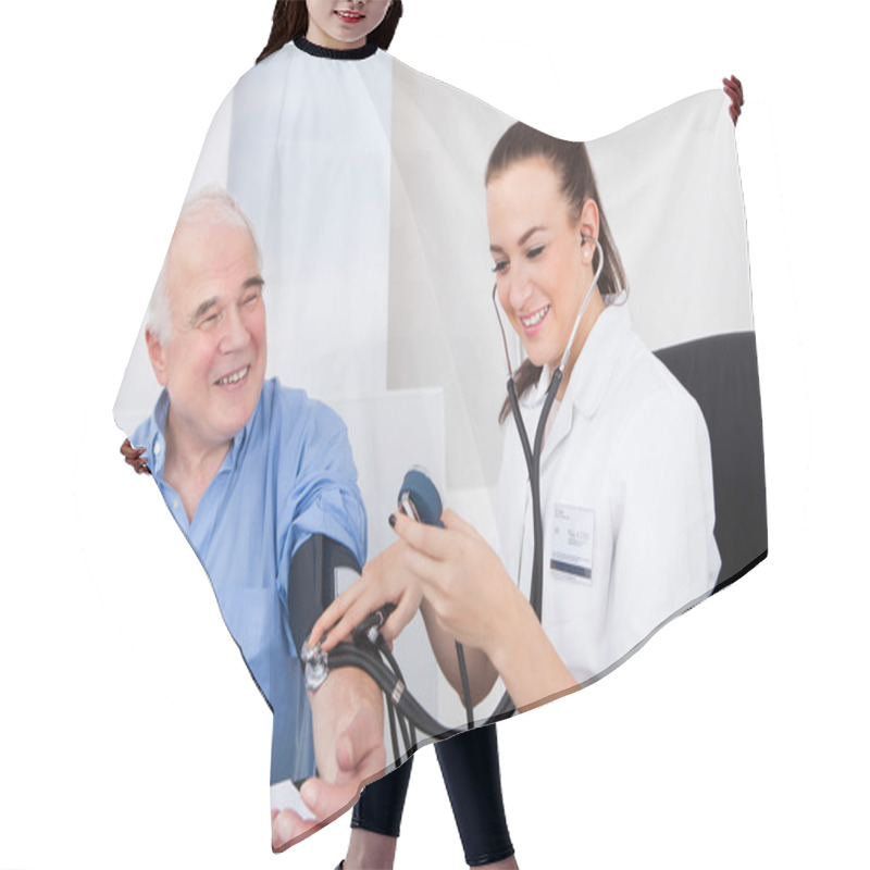 Personality  Doctor Measuring Blood Pressure Of Senior Man Hair Cutting Cape