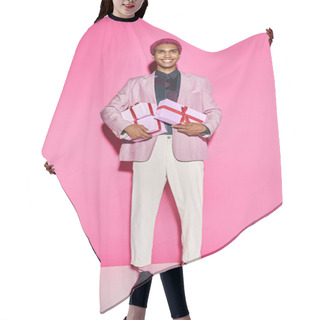 Personality  Cheerful Young Man Posing Unnaturally With Presents In His Hands Posing On Pink Background Hair Cutting Cape