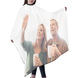 Personality  Smiling Woman Pointing Hand While Standing Near Husband Hair Cutting Cape