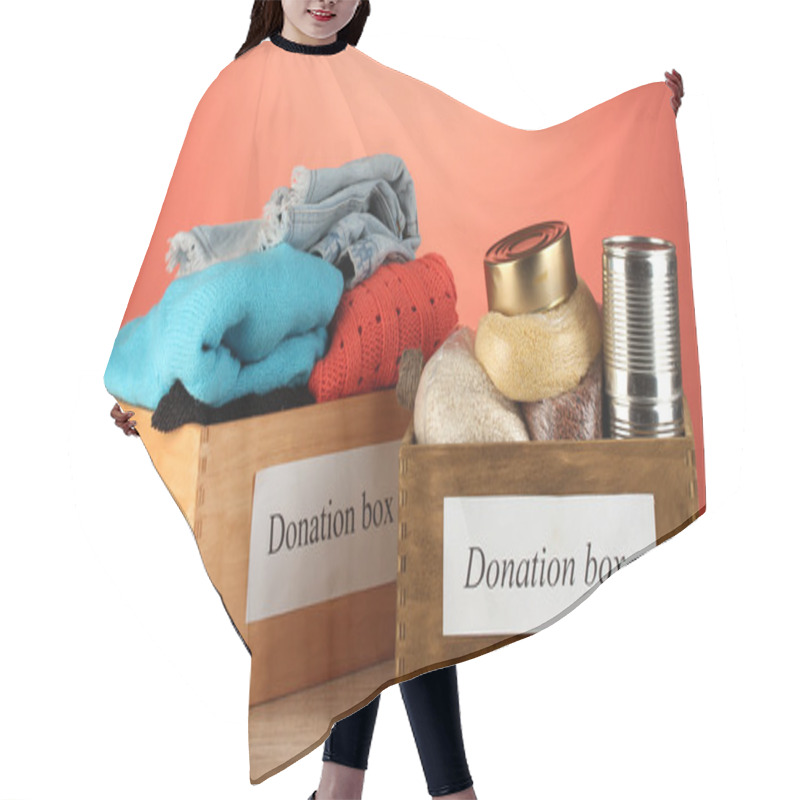 Personality  Donation Boxes With Clothing And Food On Red Background Close-up Hair Cutting Cape