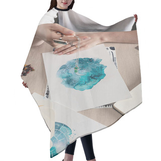 Personality  Cropped View Of Astrologer Holding Crystal Above Watercolor Drawings Of Zodiac Signs On Cards On Table Isolated On Black Hair Cutting Cape