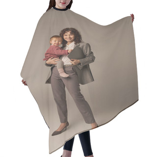 Personality  Professional Aspirations, Work Life Harmony, Happy Working Mother Holding Laptop And Daughter On Grey Background, Time Management, Self-confidence, Modern Parenting, Full Length  Hair Cutting Cape