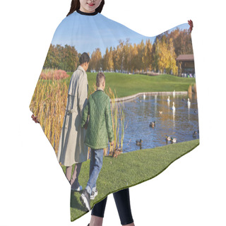 Personality  Back View Of Mother And Son In Outerwear Walking Together Near Lake With Swans And Ducks, Nature Hair Cutting Cape