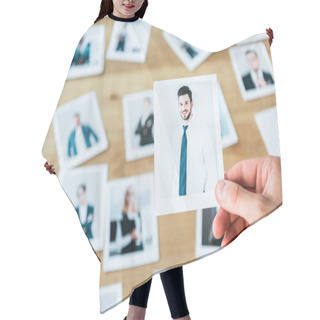 Personality  Cropped View Of Recruiter Holding Photo With Man In Suit  Hair Cutting Cape