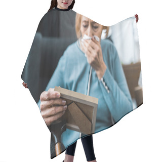 Personality  Grieving Senior Woman Crying And Wiping Face From Tears With Tissue While Looking At Picture Frame  Hair Cutting Cape