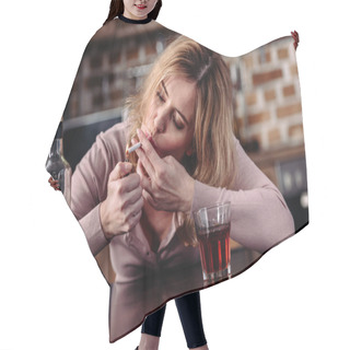 Personality  Portrait Of Woman Smoking Cigarette While Sitting At Table With Glass Of Alcohol At Home Hair Cutting Cape