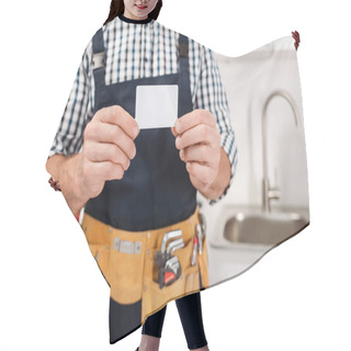 Personality  Cropped View Of Workman In Tool Belt Holding Empty Card In Kitchen  Hair Cutting Cape