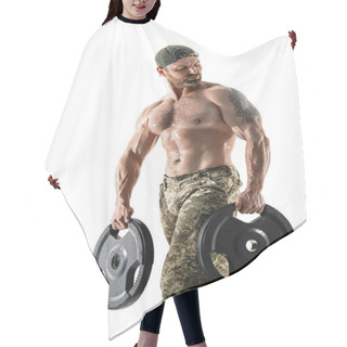 Personality  Muscular Athlete Bodybuilder Man In Camouflage Pants With A Naked Torso Workout With Dumbbell On A White Background. Hair Cutting Cape
