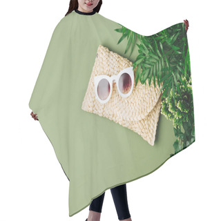 Personality  Tropical Leaves And Beach Bag With Sunglasses  On  Green  Background. Top View, Flat Lay. Hair Cutting Cape