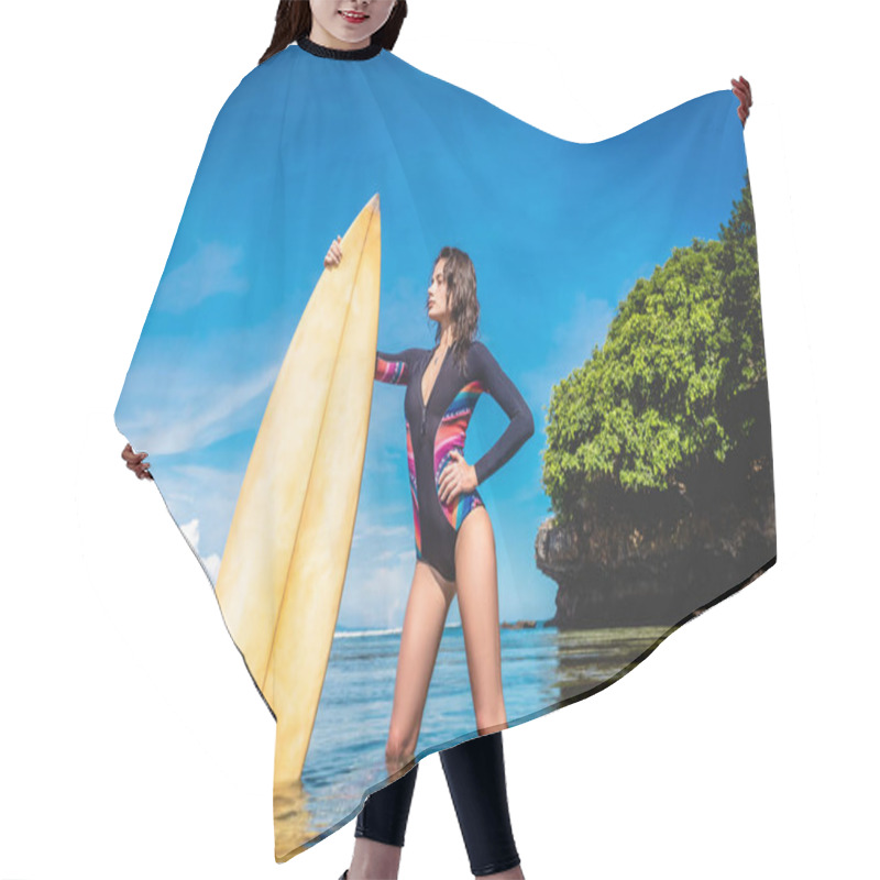 Personality  Attractive Young Woman In Wetsuit With Surfboard Posing In Ocean At Nusa Dua Beach, Bali, Indonesia Hair Cutting Cape