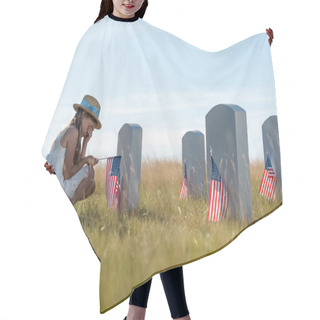 Personality  Selective Focus Of Child Covering Face While Sitting Near Headstones With American Flags  Hair Cutting Cape
