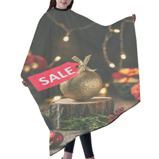 Personality  Golden Christmas Ball With Red Sale Tag On Wooden Stump With Light Garland Hair Cutting Cape