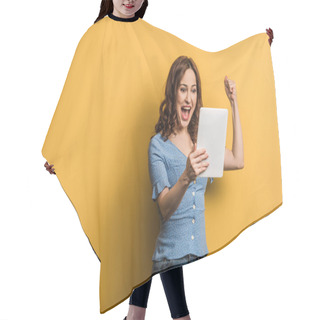 Personality  Excited Woman Showing Winner Gesture While Holding Digital Tablet On Yellow Background Hair Cutting Cape