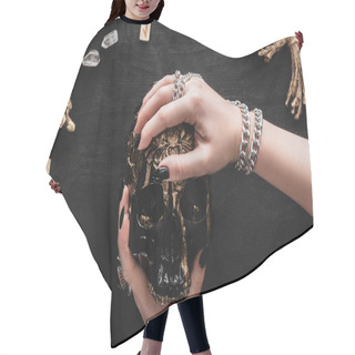 Personality  Cropped View Of Woman Holding Skull Near Crystals And Runes On Black  Hair Cutting Cape