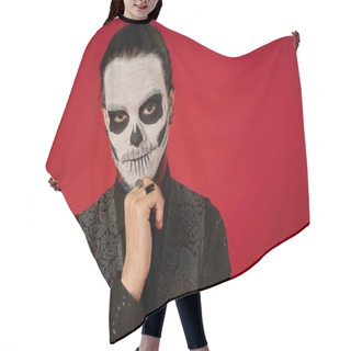 Personality  Man In Spooky Skeleton Makeup Holding Hand Near Chin And Looking At Camera On Red, Day Of Dead Hair Cutting Cape