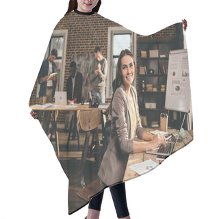 Personality  Smiling Business Woman Sitting At Desk With Laptop And Working On Project At Loft Office With Colleagues On Background Hair Cutting Cape