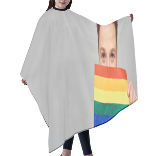 Personality  Joyful Redhead Queer Person Obscuring Face With Small LGBT Flag Looking At Camera On Grey, Banner Hair Cutting Cape
