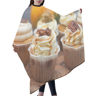 Personality  Pumpkin Cupcakes Decorated With Cream Cheese Frosting, Maple Syrop, Pecan Nuts And Caramel Bites On Rustic Wooden Background. Hair Cutting Cape
