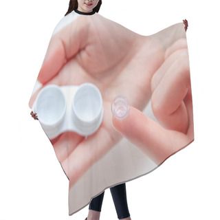 Personality  Contact Eye Lenses. Woman Hands Holding Contact Eye Lens. Woman Hands Holding White Container. Beautiful Woman Fingers Holding Eye Lens Box. Health And Eyes Care Concept. High Resolution Hair Cutting Cape