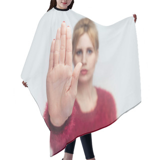 Personality  Serious Beautiful Young Blonde Woman In Red Sweater Standing With Stop Gesture Sign And Looking At Camera On Light Gray Background Hair Cutting Cape