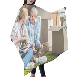 Personality  Happy Senior Couple Sitting On Carpet And Counting Money During Relocation  Hair Cutting Cape