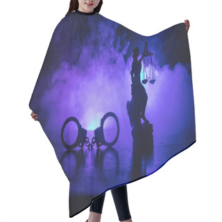 Personality  Legal Law Concept. Silhouette Of Handcuffs With The Statue Of Justice On Backside With The Flashing Red And Blue Police Lights At Foggy Background. Selective Focus Hair Cutting Cape